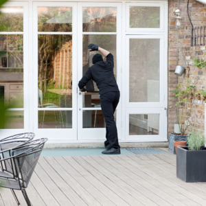 Burglar looking into house when no one is home